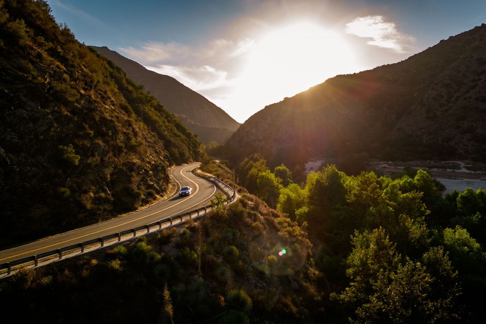Scenic shot of a road and mountain silhouettes at Azusa Canyon in Azusa, California during sunset